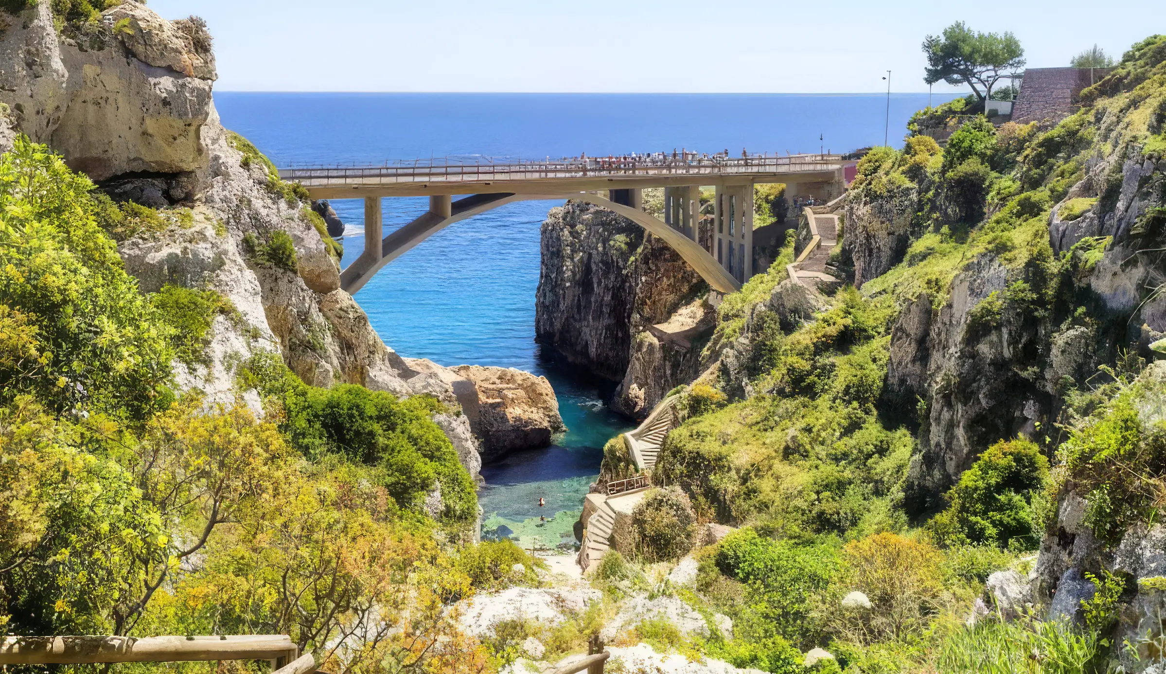 The dramatic coastal canyon and bridge at Il Canalone del Ciolo.