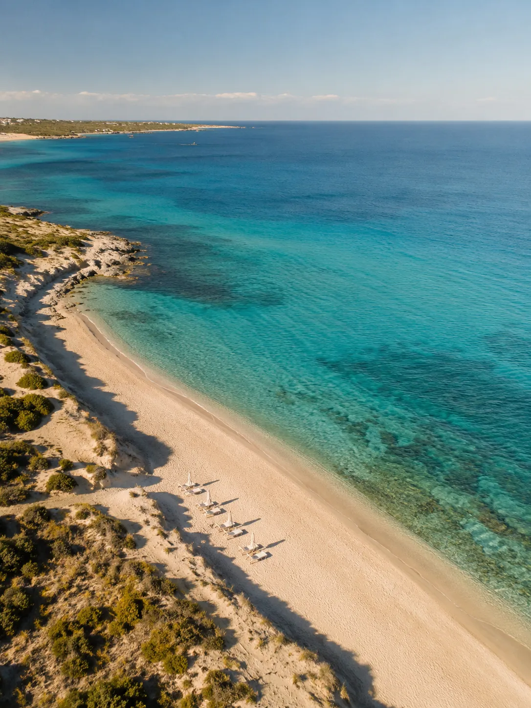 Crystal clear turquoise water on the pristine Salento coastline.